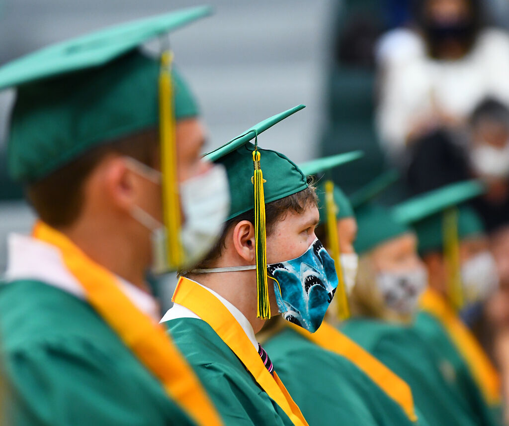 Students six in a row with six feet between them to keep social distancing on Thursday
